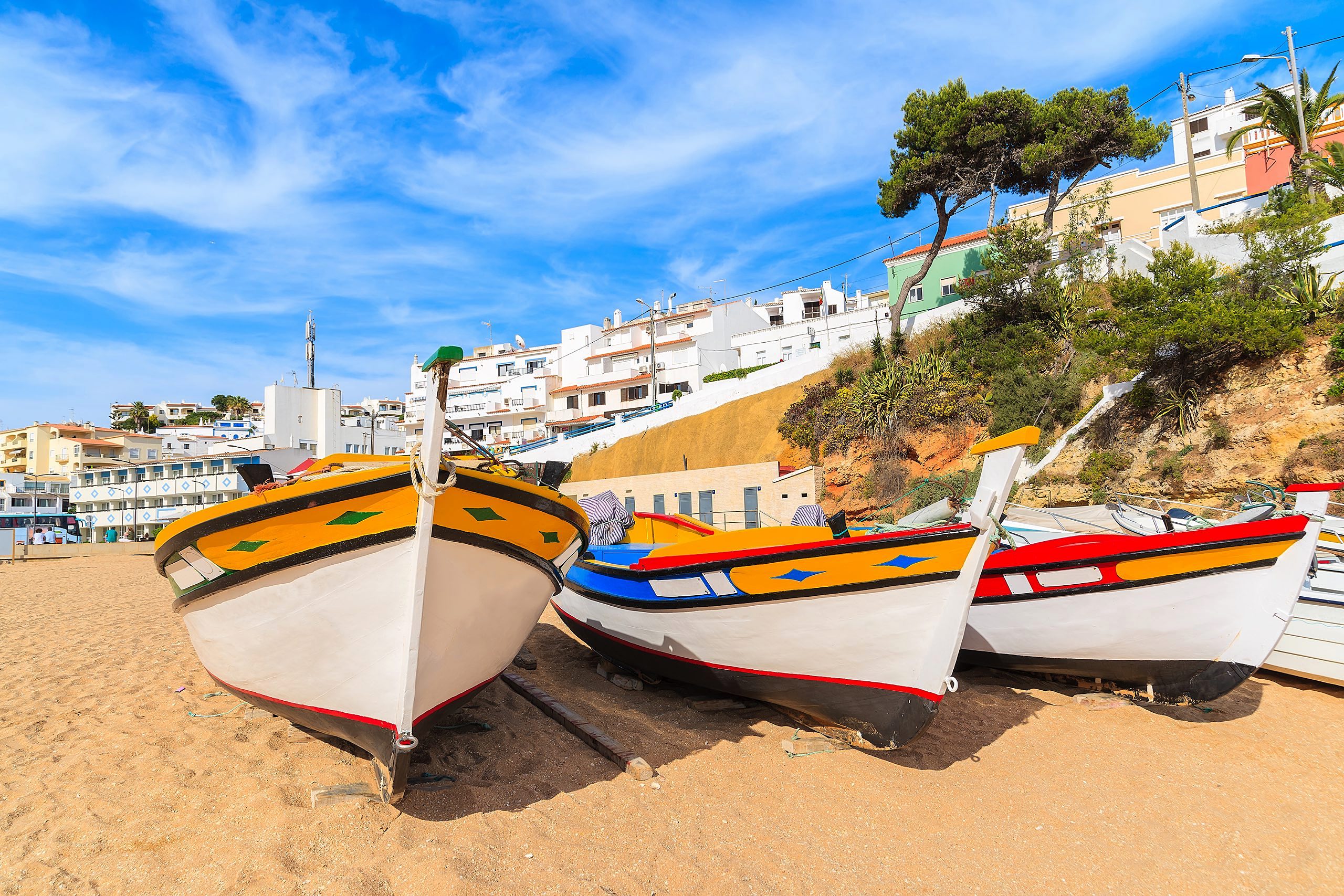 Traditional colourful fishing boats on beach in Carvoeiro village, Algarve region, Portugal copy Traditional colourful fishing boats on beach in Carvoeiro village, Algarve region, Portugal