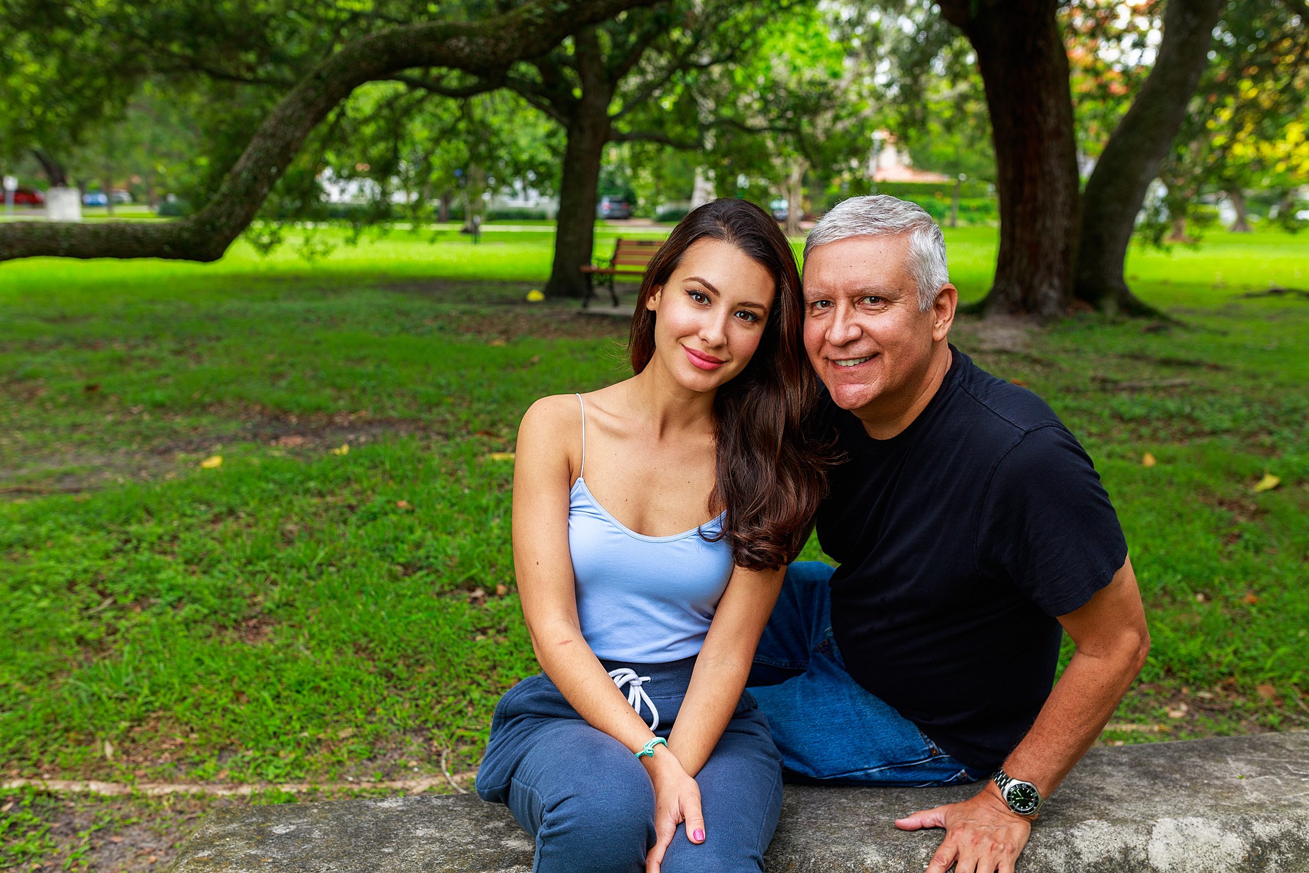 Father,And,Daughter,Outdoor,Portrait,In,A,Park,Setting. Father and daughter. Outdoors portrait